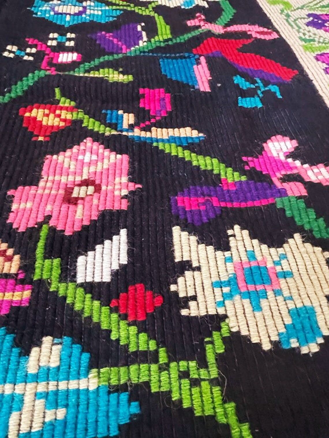 Romanian wool carpet floral design with green border on black background 180x153cm