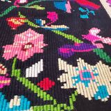 Romanian wool carpet floral design with green border on black background 180x153cm