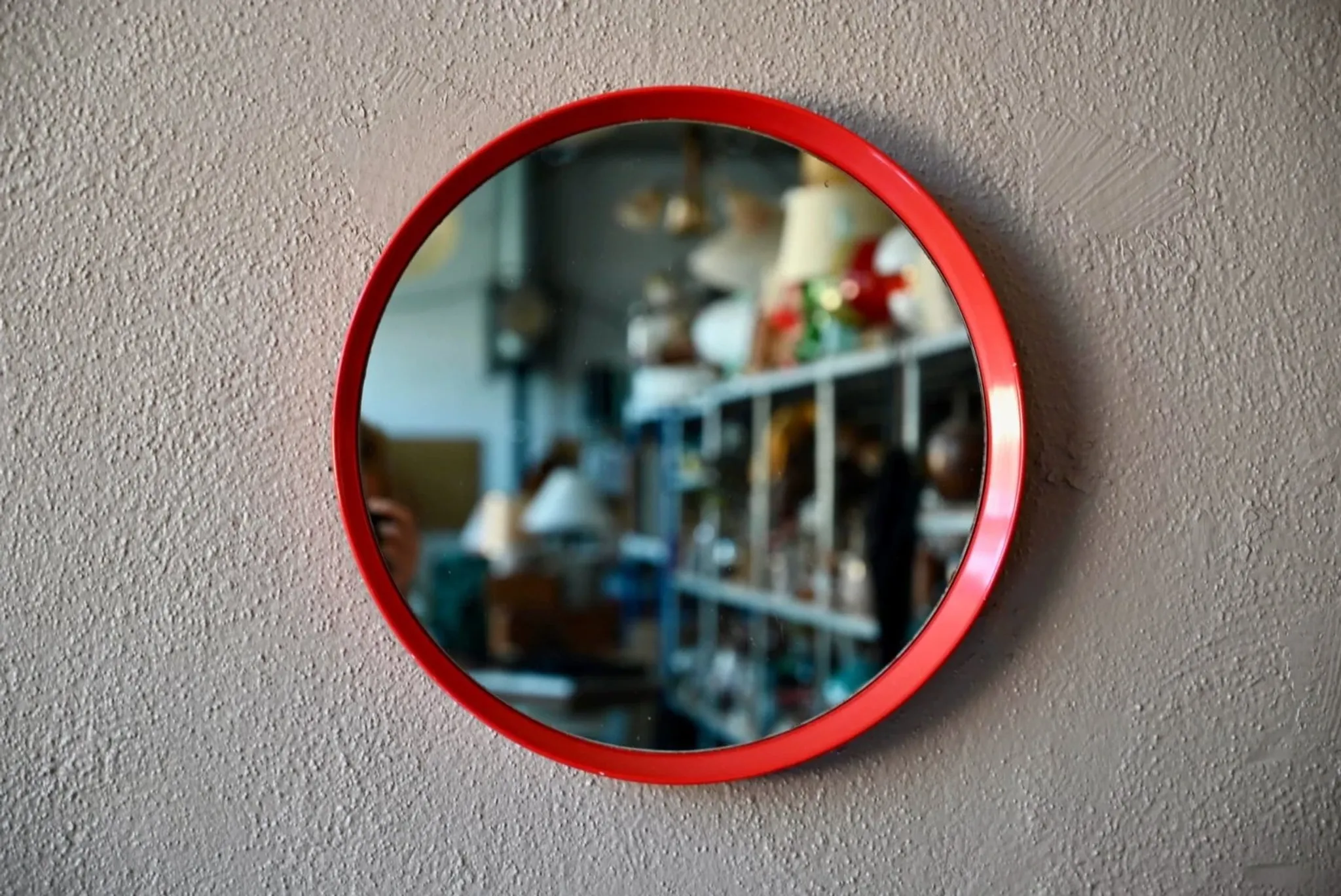 Round Pop Art mirror from the 60s-70s in bright red plastic.