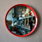 Round Pop Art mirror from the 60s-70s in bright red plastic.