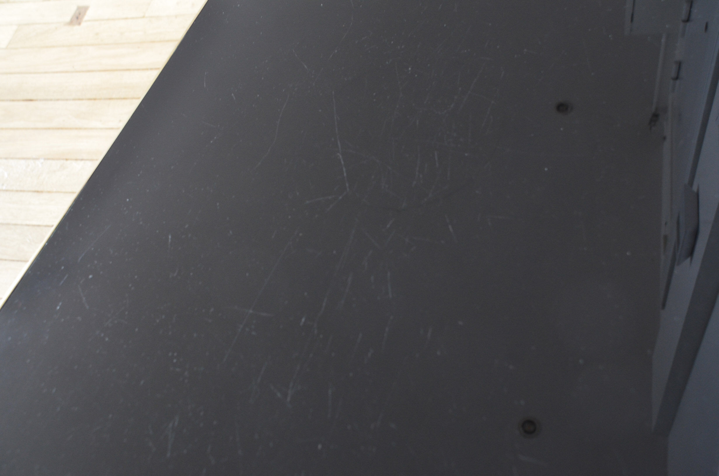 Black glass and brass coffee table in the 1960s