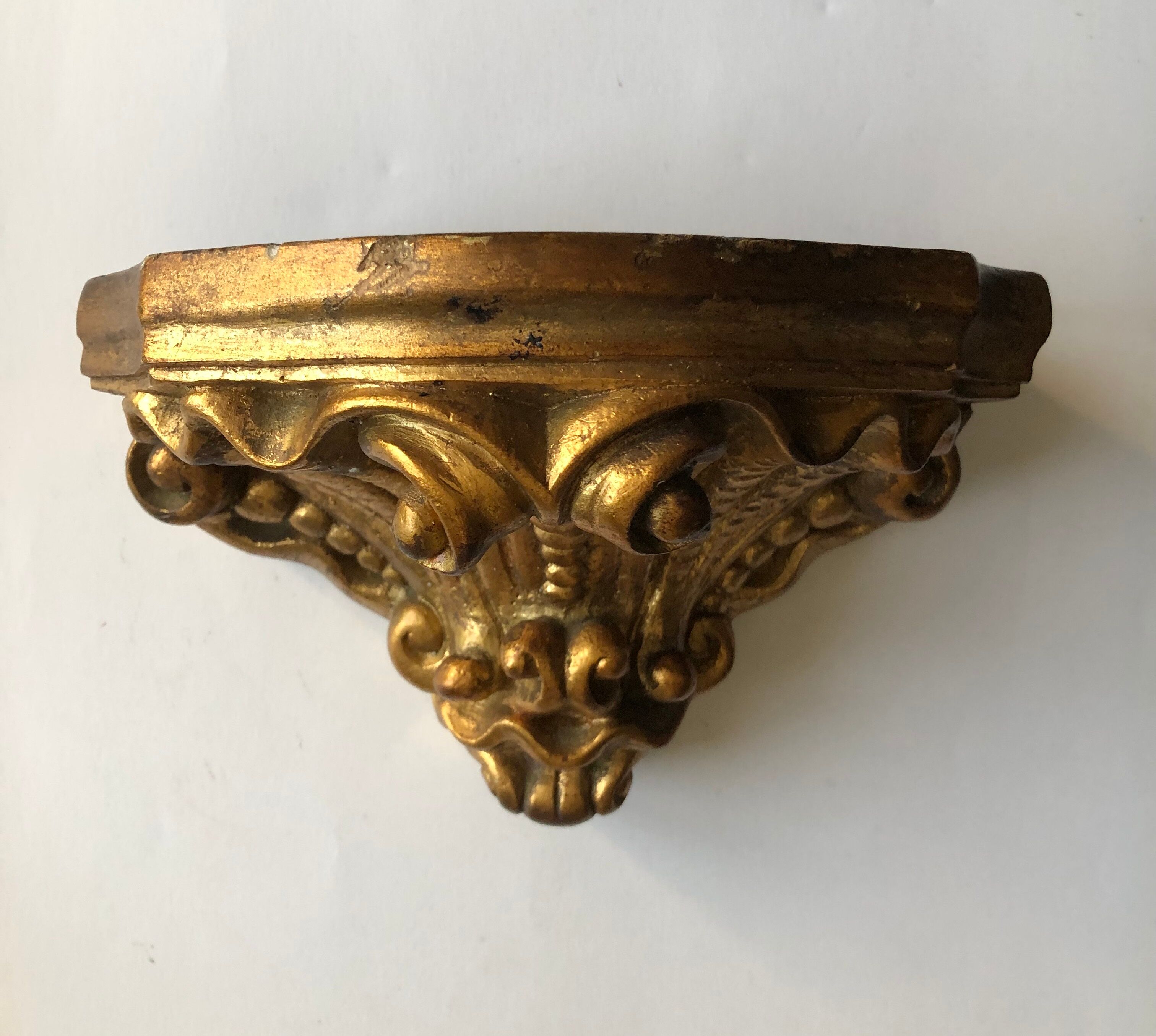 Wall console in gilded plaster