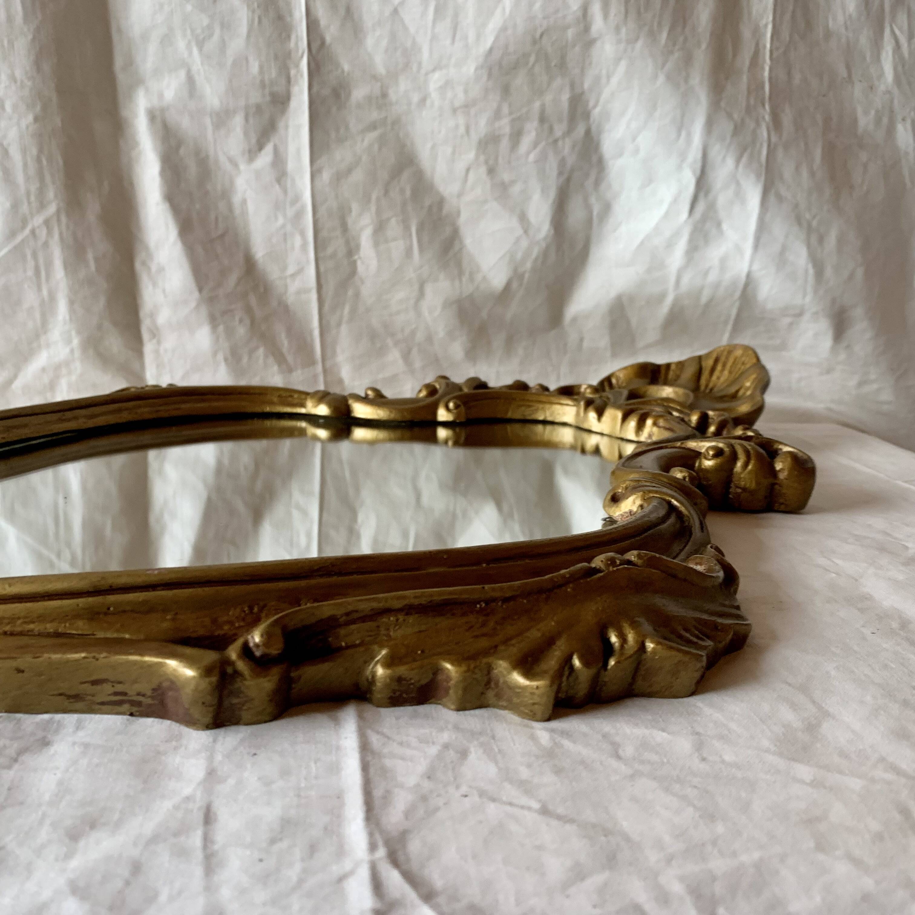 Vintage shell mirror in gold plaster