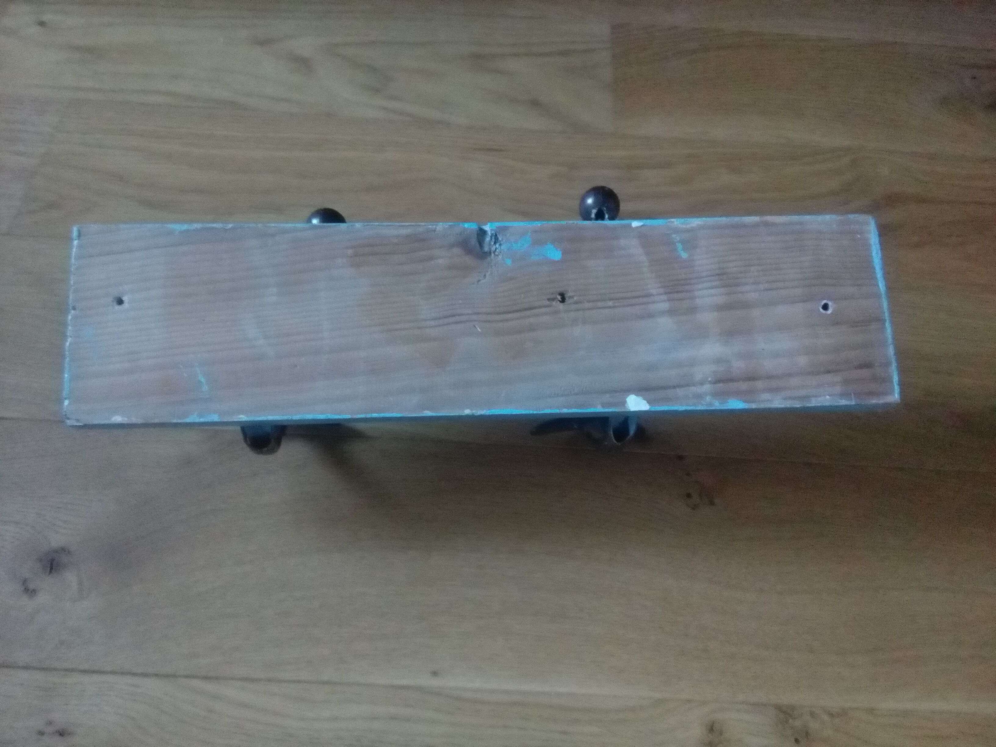 Wall coat holder with two metal pads