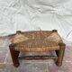Rustic footrest made of wood and straw