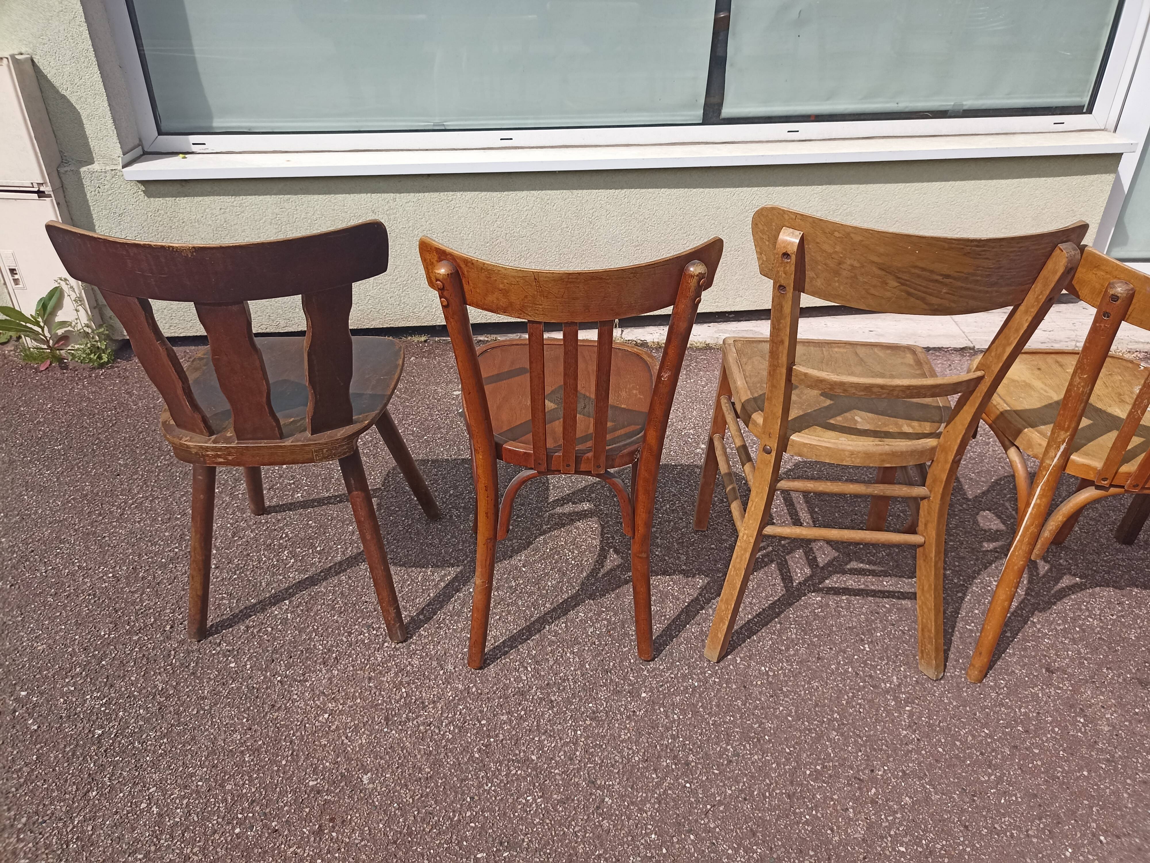 Set of 12 mismatched wooden bistro chairs