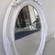 Antique oval mirror in painted wood