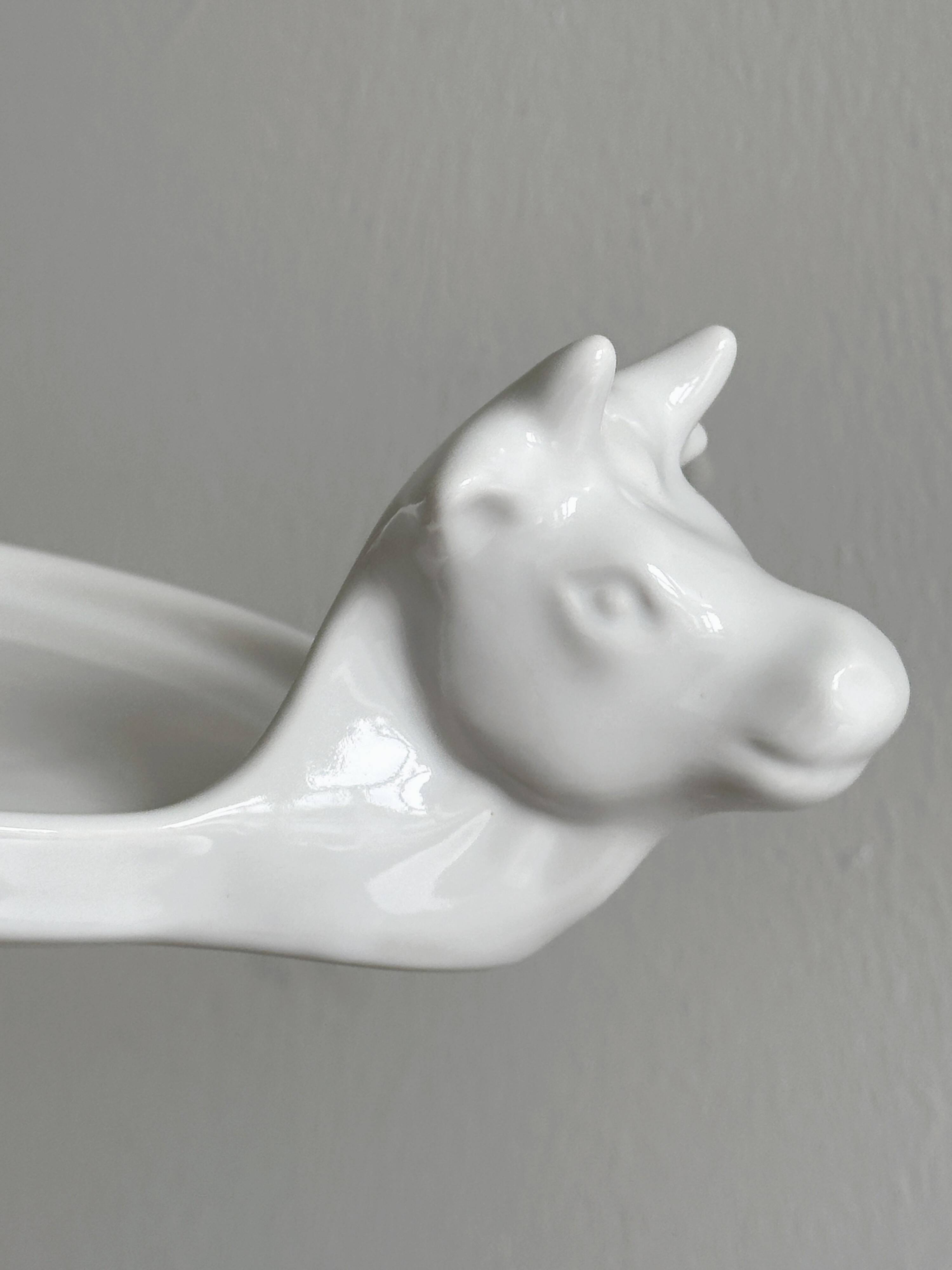 White porcelain cheese dish with handle and cow's head