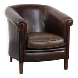 Stylish and sturdy dark brown club armchair made of sheepskin leather