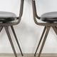 Pair of industrial style chairs in metal and faux black leather