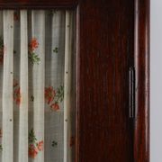 French Art Deco tall cabinet with glass door and hidden compartiment, ca. 1