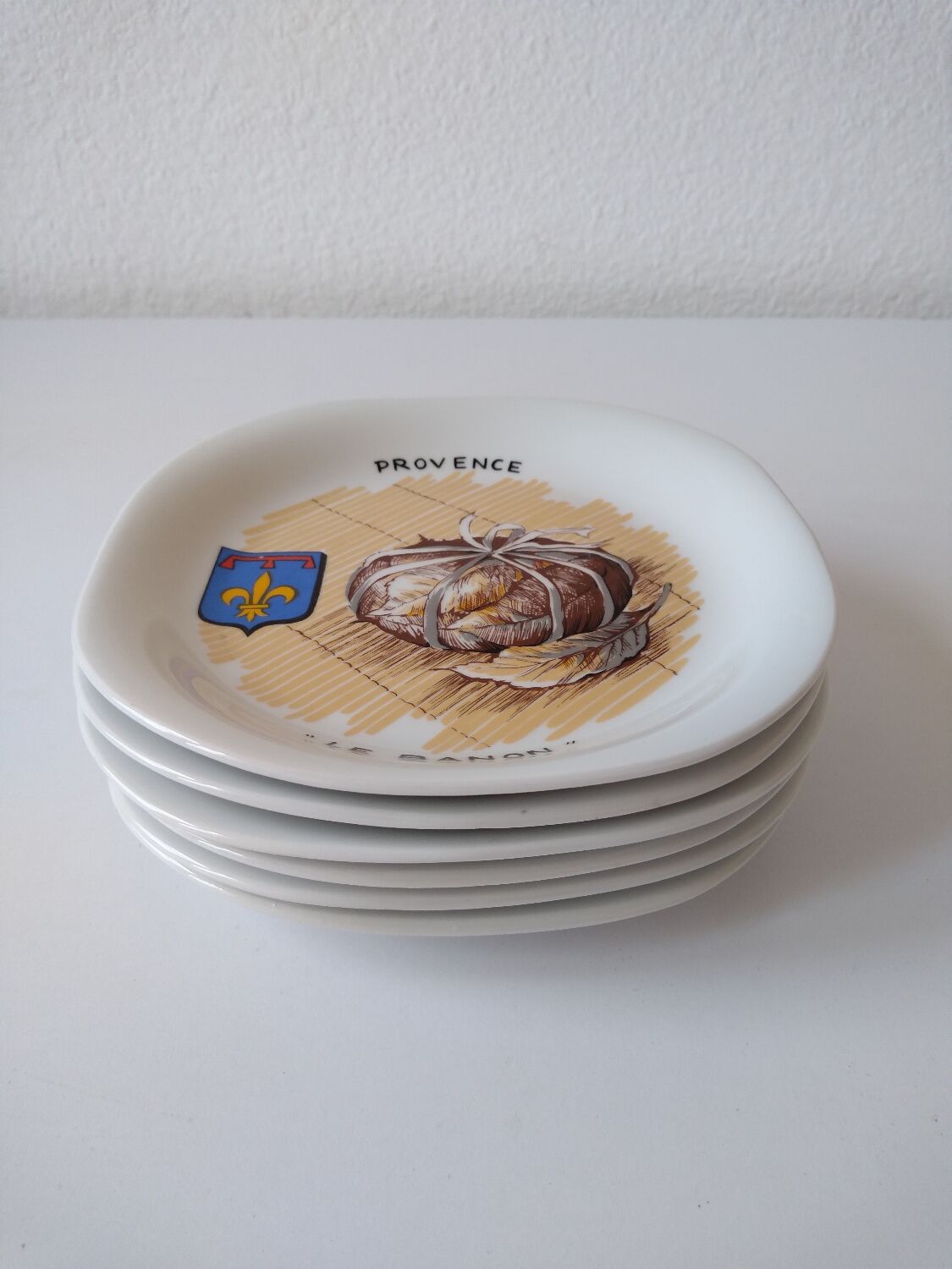 Limoges porcelain cheese service with drawing of regional cheeses and coats of arms 1 tray and 6 plates