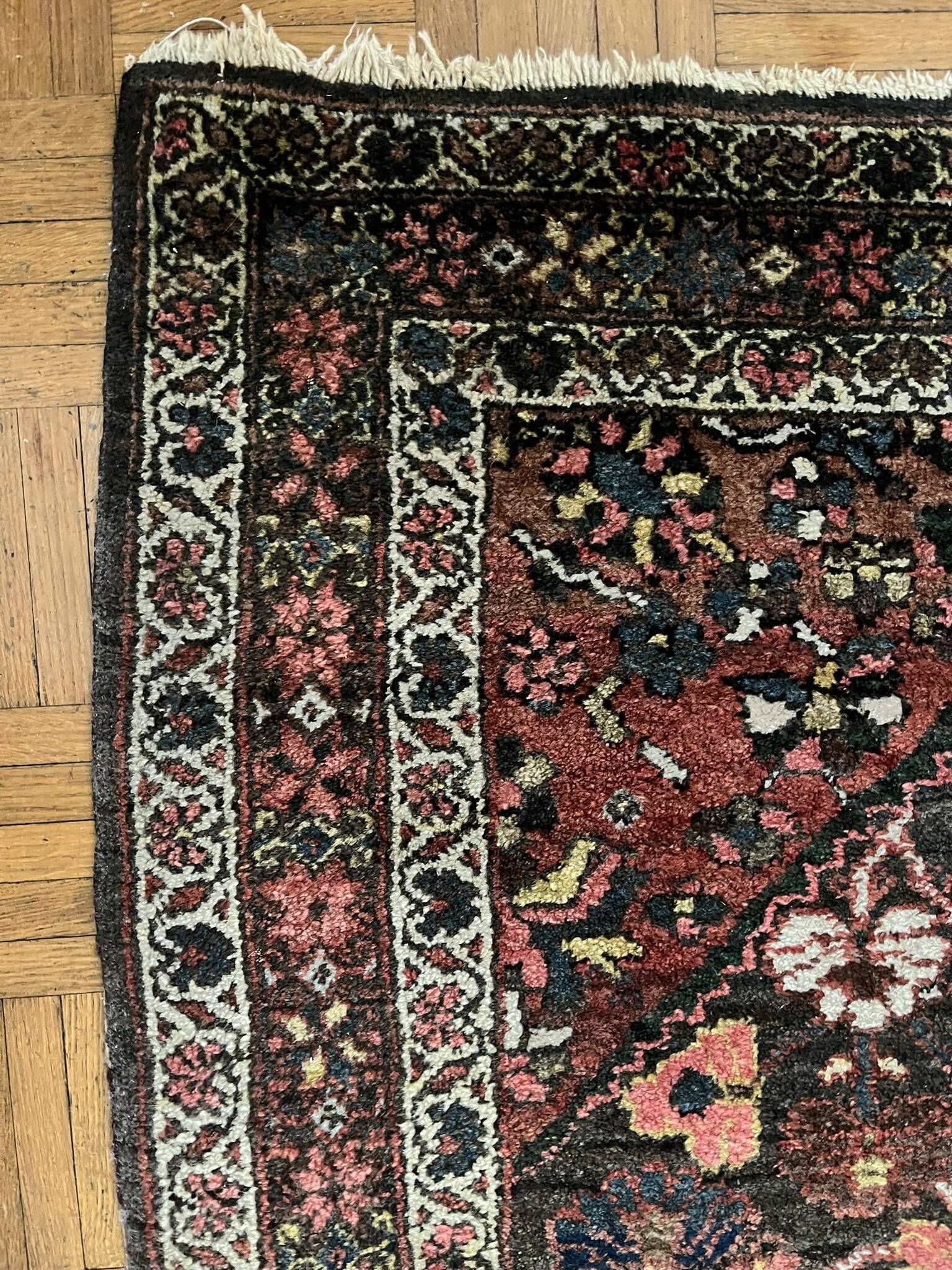 Antique handmade Hamadan Persian rug, ivory medallion on dark background 148x103.