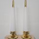 Pair of Hollywood Regency table lamps in brass with glass shades.