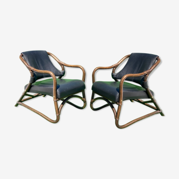 Pair of bamboo lounge chairs with skai leather