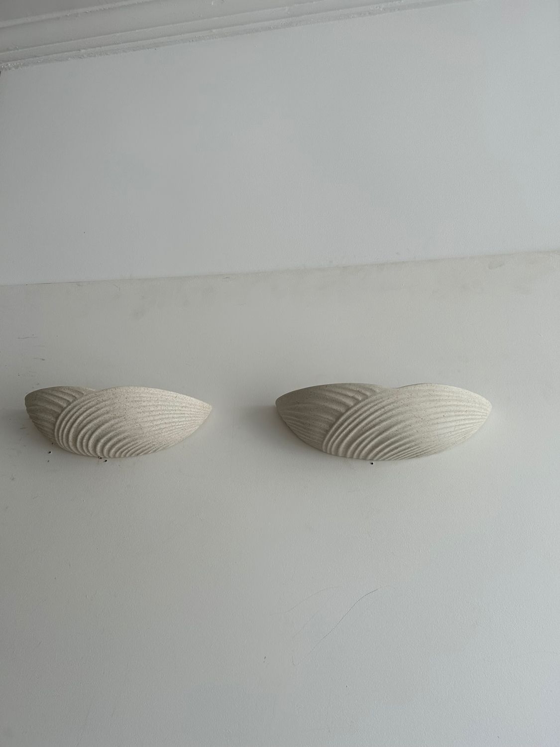 Pair of wall lamps in molded plaster France 1980