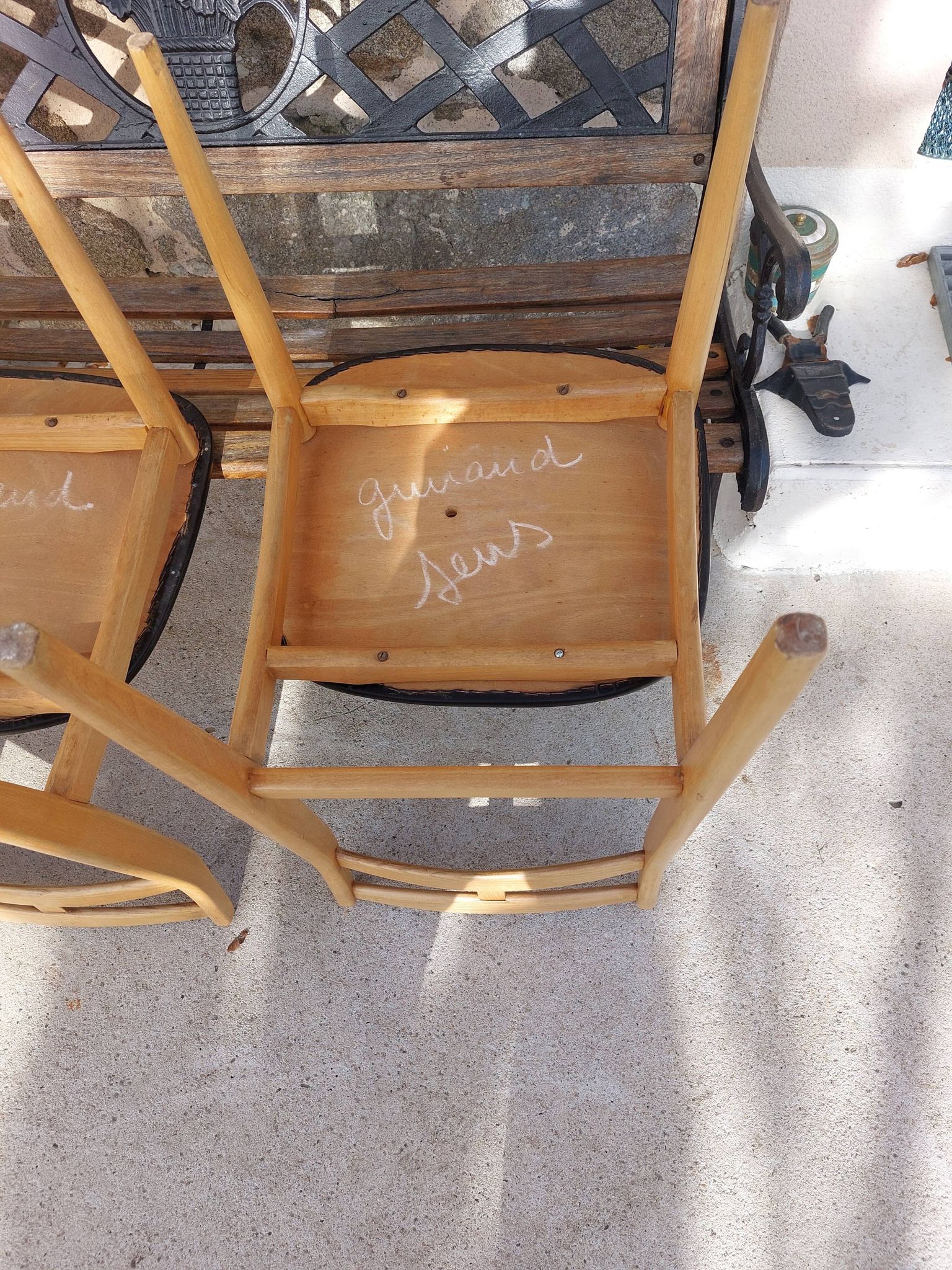 3 Scandinavian style chairs, light wood and black faux leather.