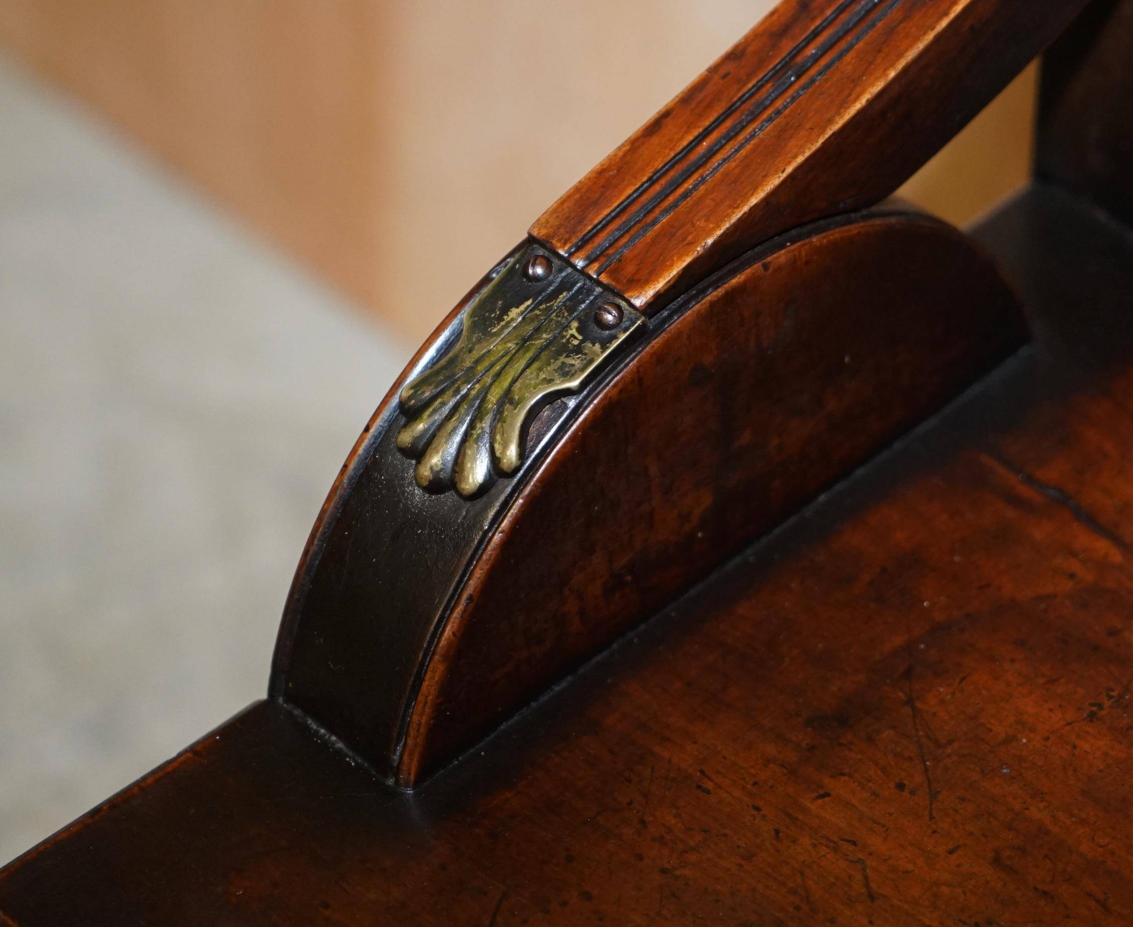 Antique entrance bench by Jas Shoolbred with brass fittings and walnut frame circa 1890.