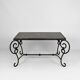 Coffee table in patinated wrought iron and black marble, circa 1940