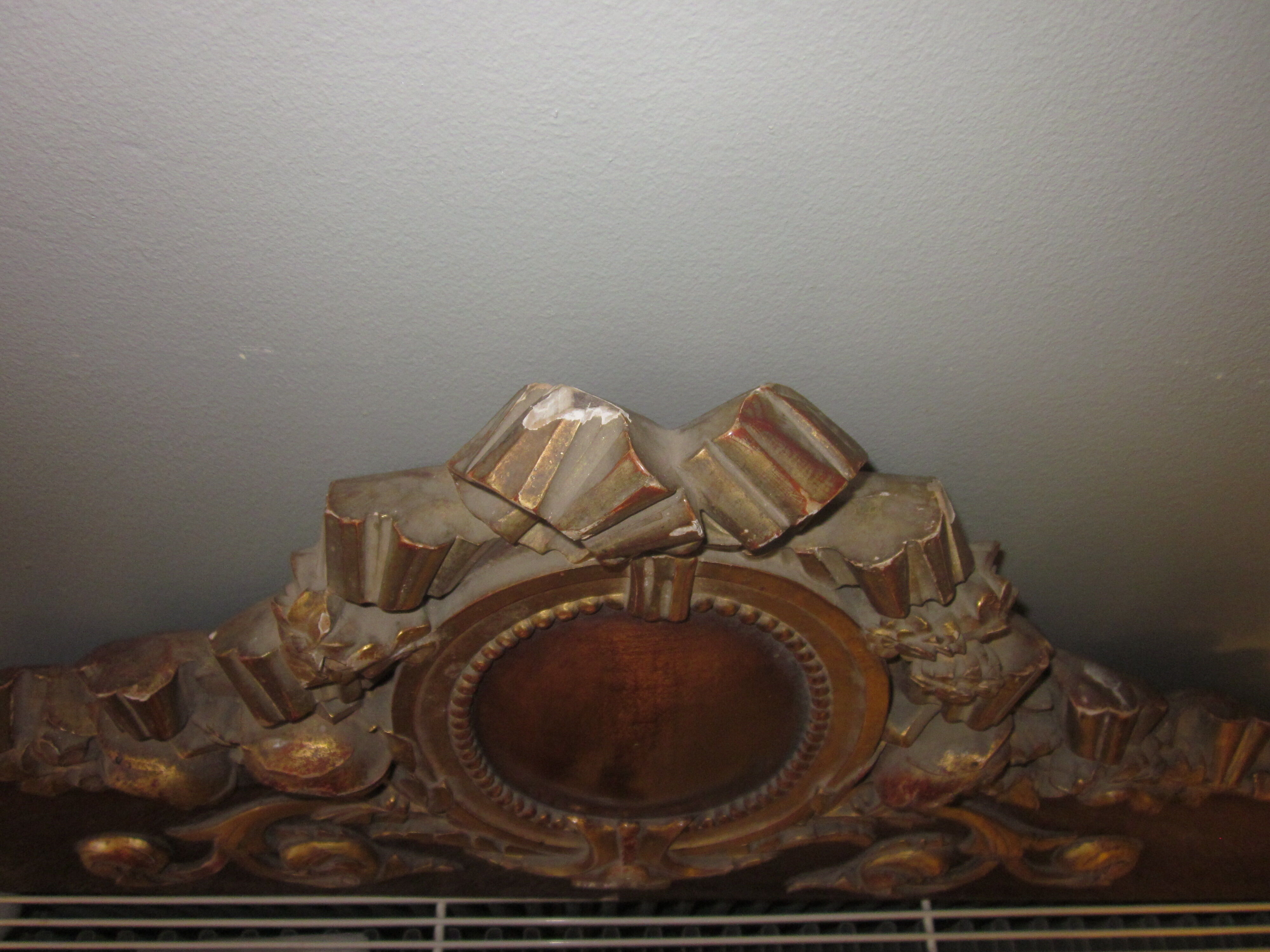 Old wooden pediment stucco