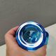 A set of iitalla candle holders in blue transparent glass.