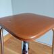 Caramel skaï stool and tapered feet in chrome metal
