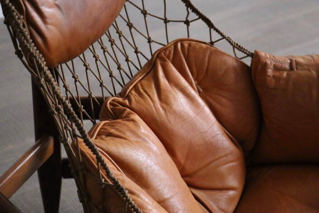Jangada lounge chair with ottoman in cognac leather by Jean Gillon, Brazil, 1960s