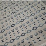 Handmade white and blue rug made of natural wool