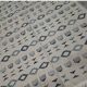 Handmade white and blue rug made of natural wool