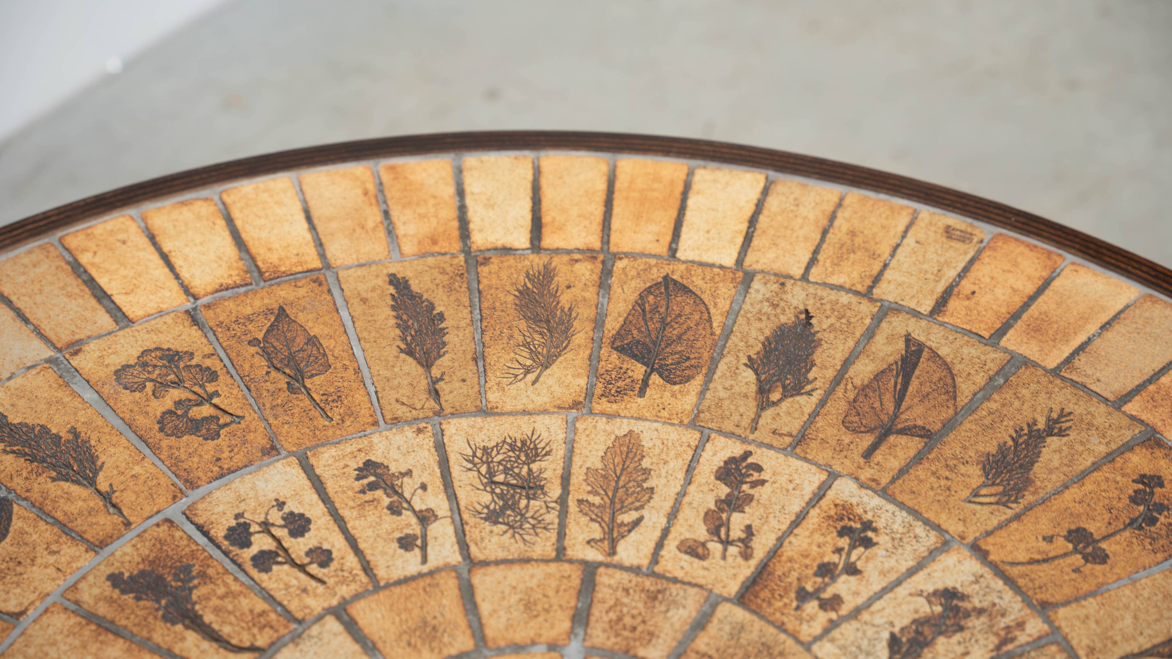 Round coffee table by Roger Capron