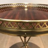Round brass and mahogany sofa end from Jansen