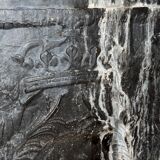 huge old fireplace plate has decoration of angels, crown and fleurs-de-lis