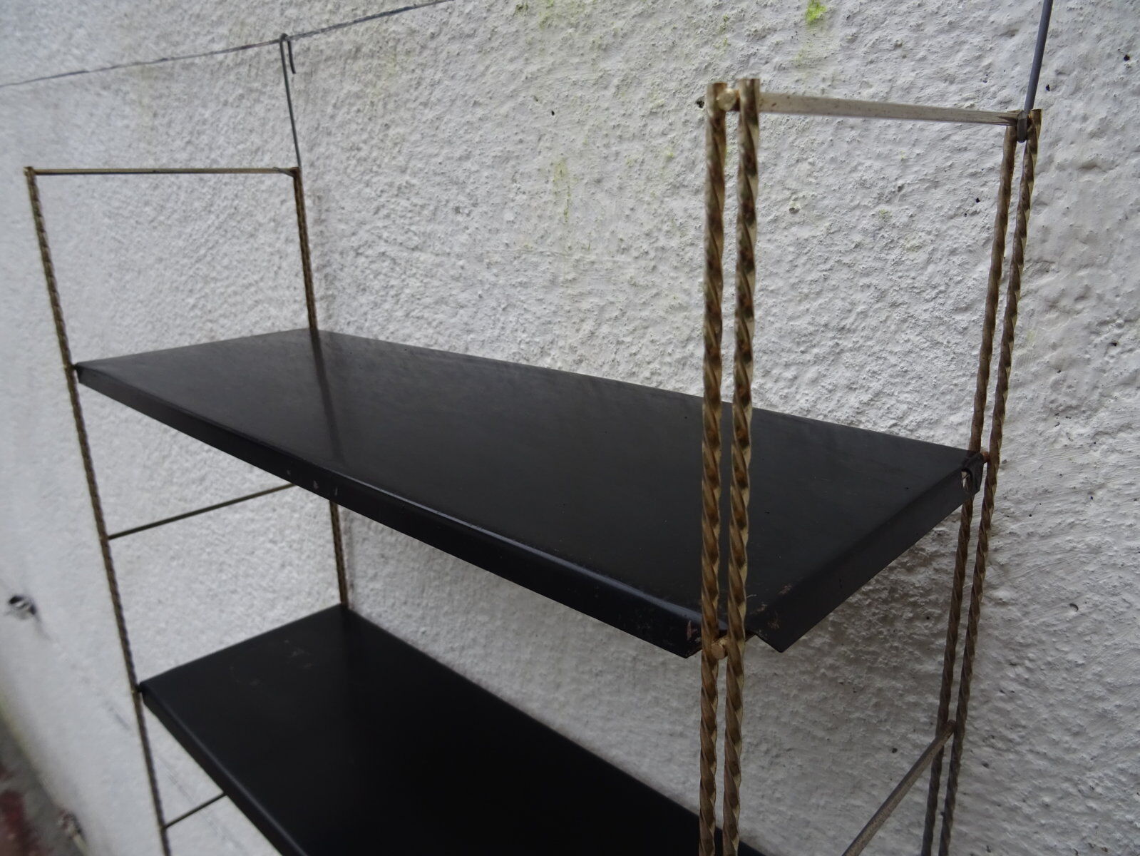 Metal thong wall shelf