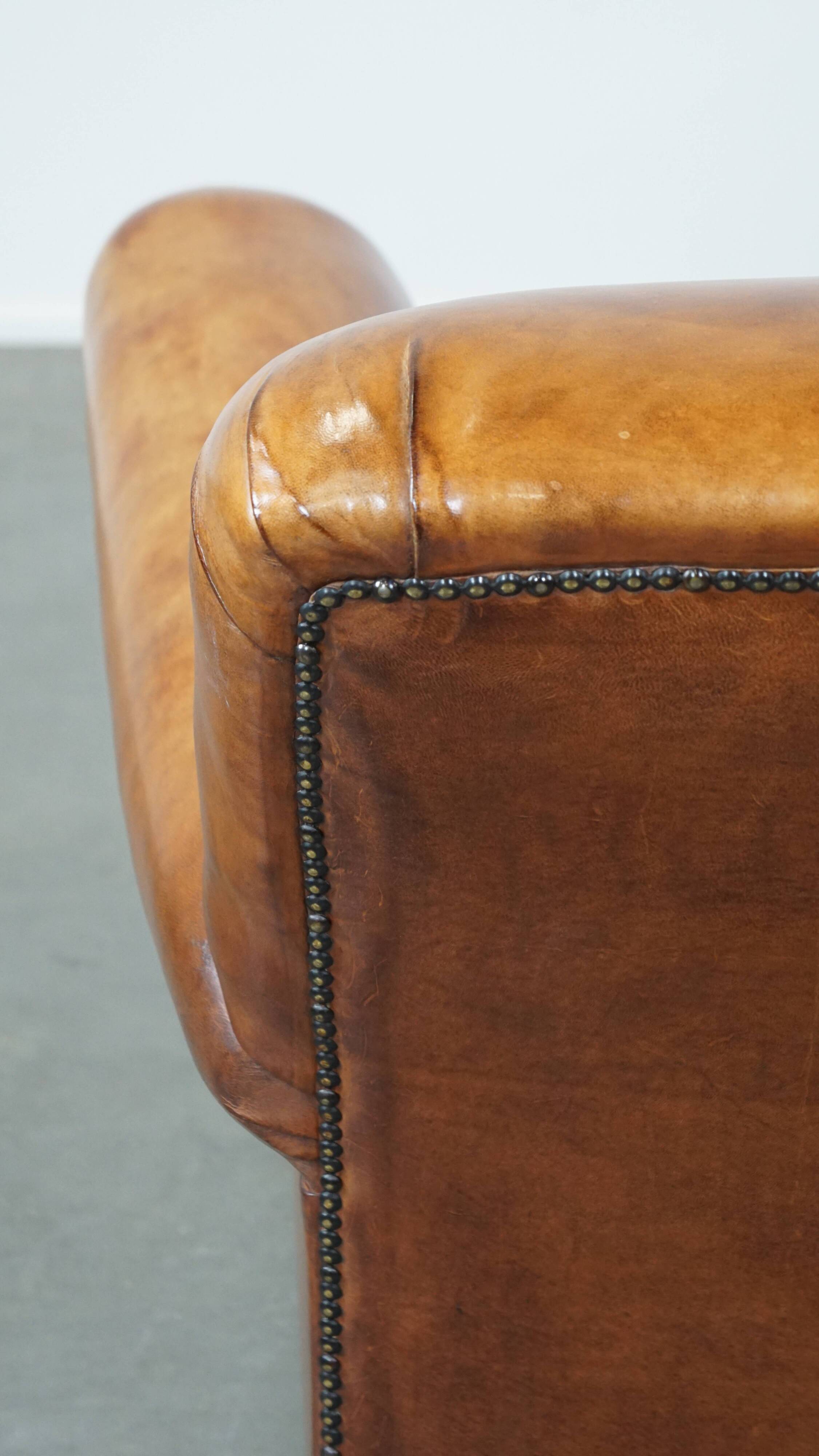 Cognac-colored antique sheep leather armchair