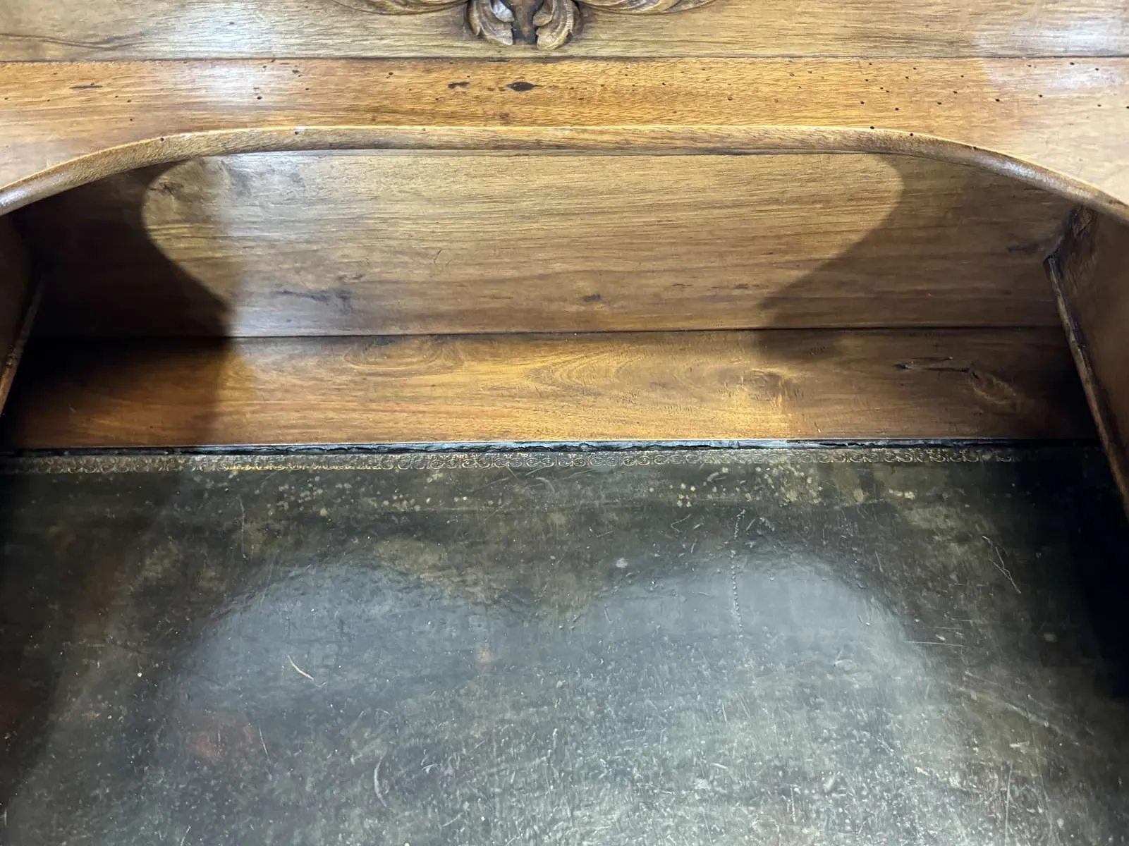 Louis XVI style desk from the late 19th century in walnut with a leather top.