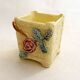 Small rose-patterned cache-pot in earthenware.