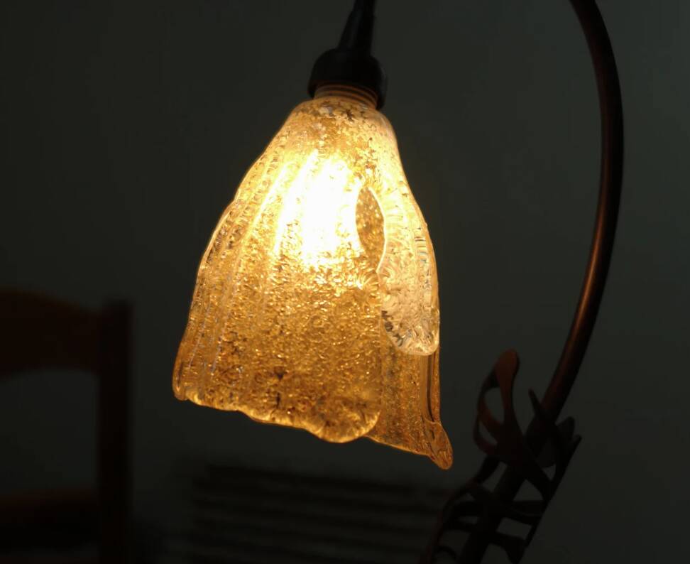 Art Deco lamp in wrought iron and blown glass.