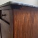 Vintage bedside table in the shape of a wooden column and a gray marble top