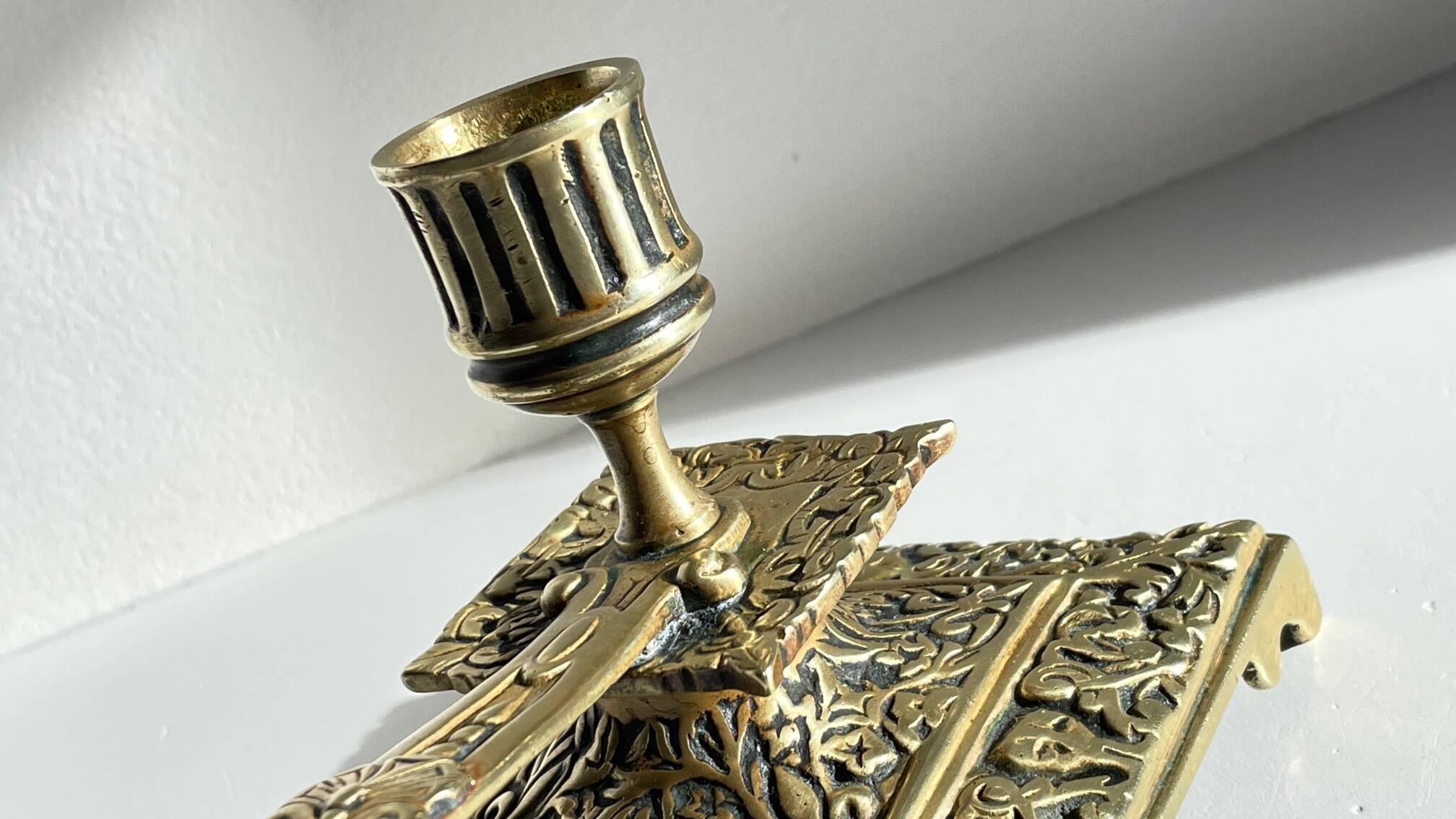 Patterned solid bronze hand candle holder