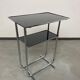 Bauhaus side table with a black glass top