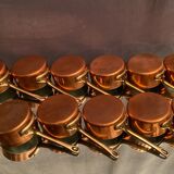 Suite of 12 tinned copper pans