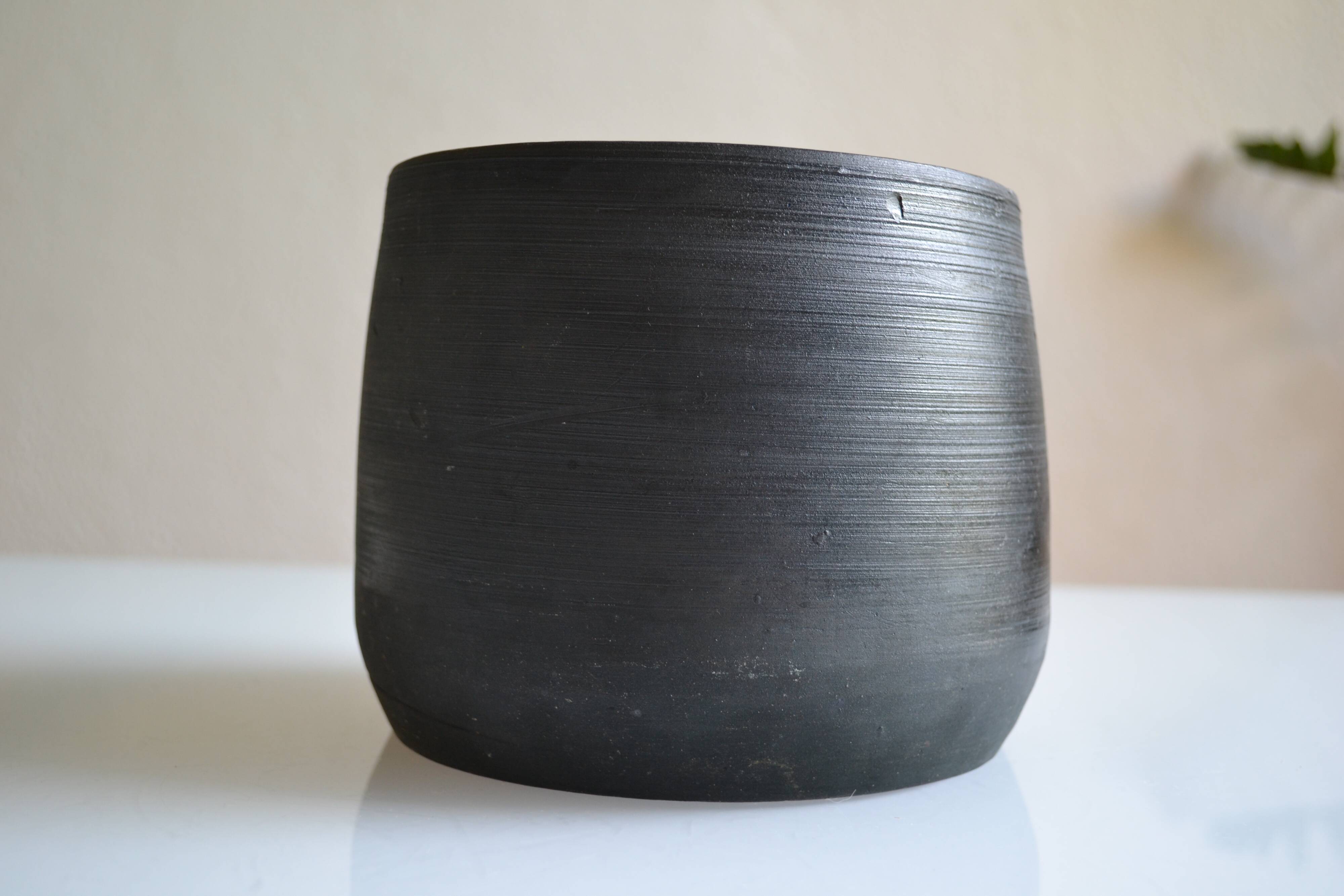 Ceramic cache pot or pocket emptying dish with a signature fish to identify.