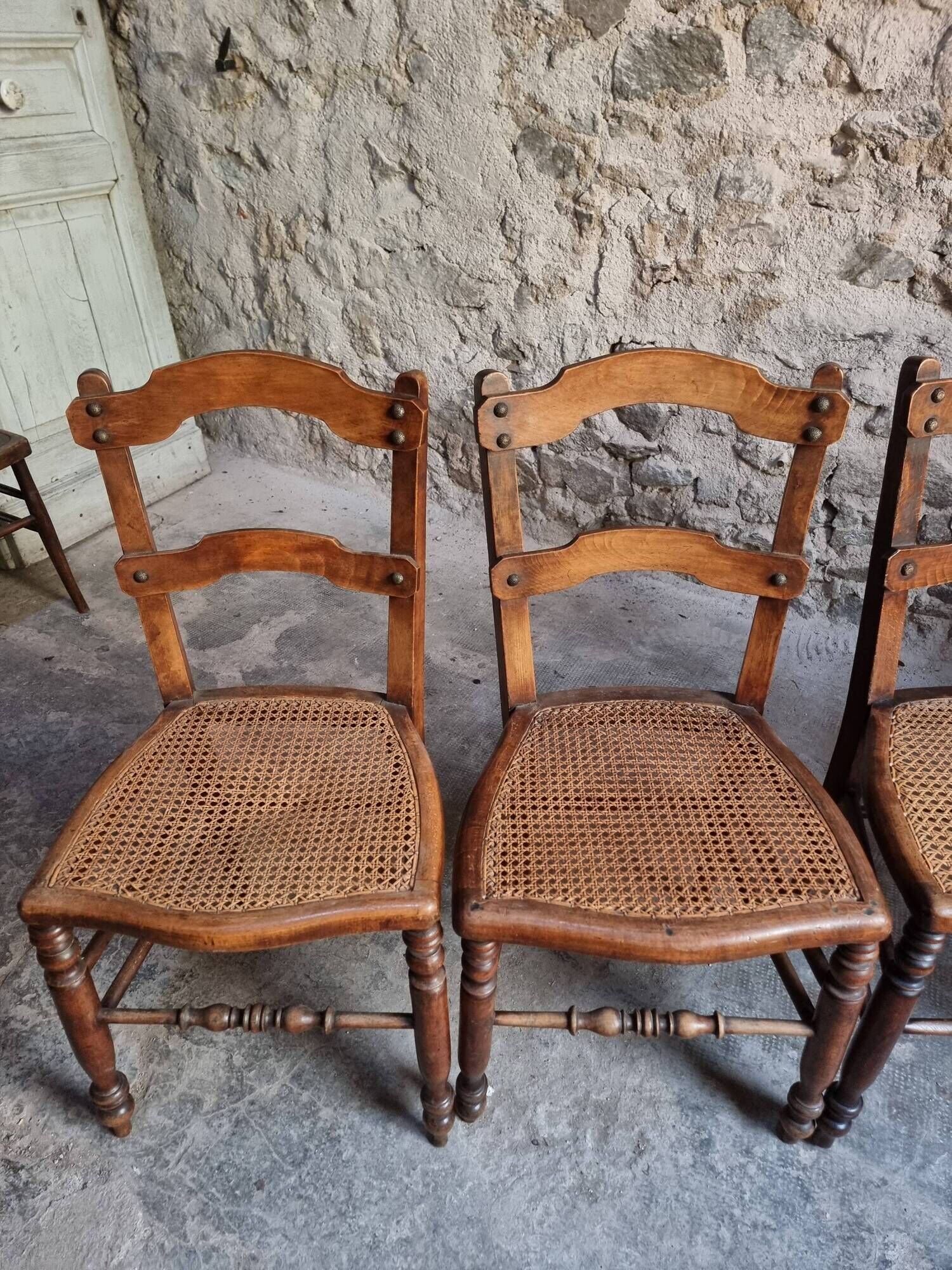 Set of 4 antique dining chairs with caned seats, beech, France, circa 1900–1920.