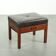 Pouf/tabouret en cuir marron chocolat au design Art Déco