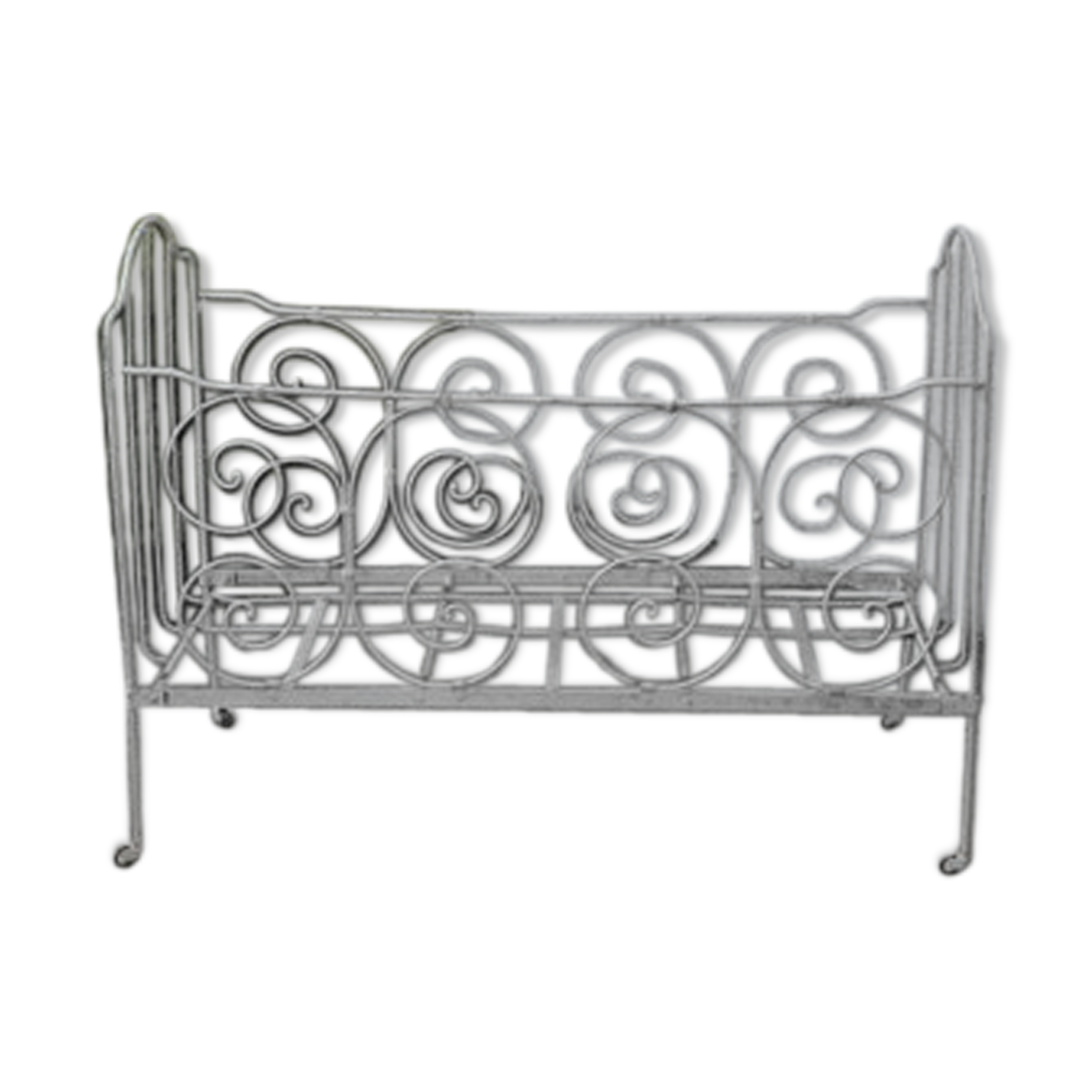 Old white wrought iron child bed