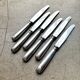 6 dessert knives by Christofle in silver-plated metal, shell decoration.