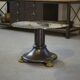 Neo-classical cast iron and glass eglomisé coffee table from the 1940s.