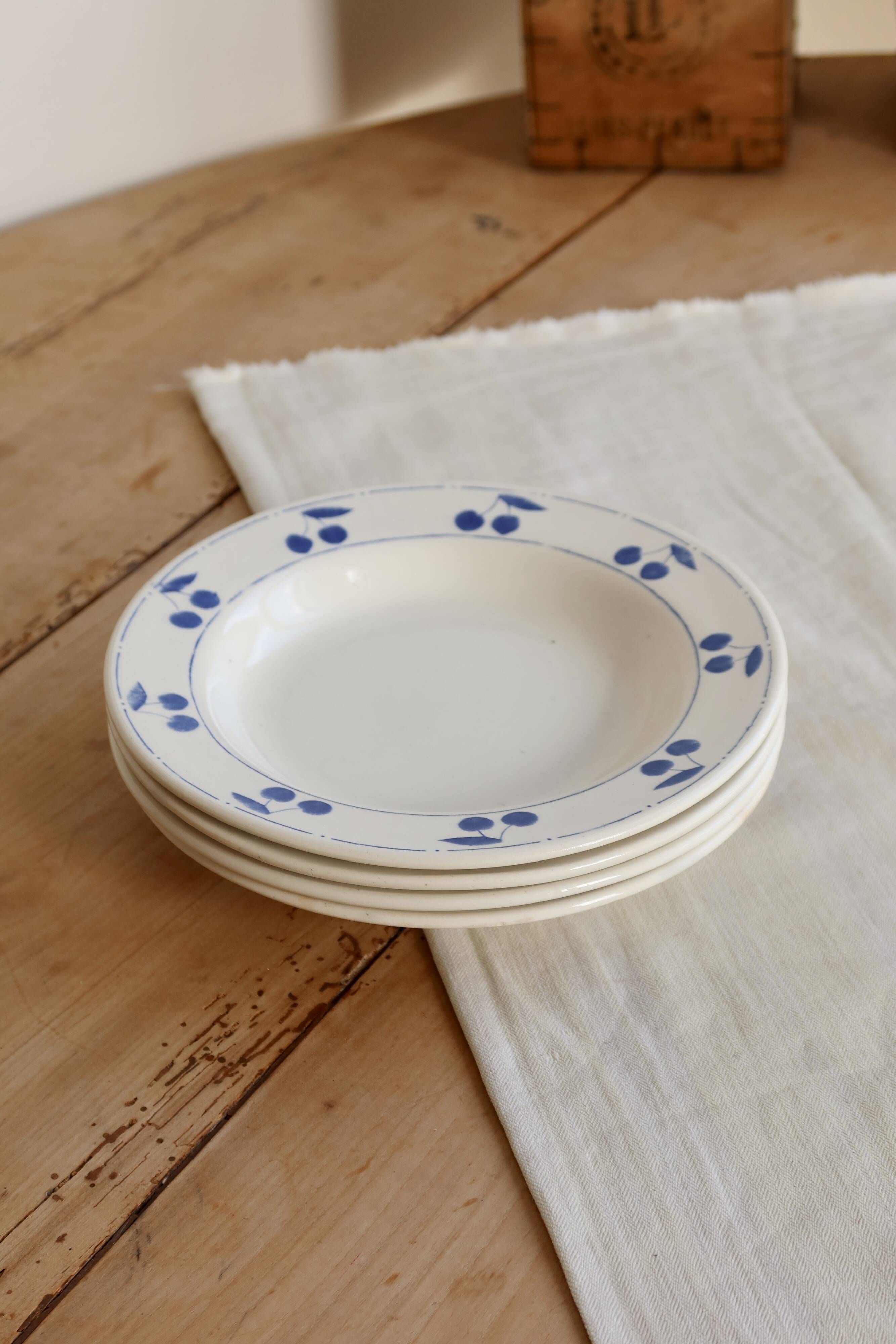 4 vintage deep plates in ivory earthenware with blue cherries