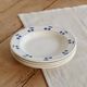 4 vintage deep plates in ivory earthenware with blue cherries