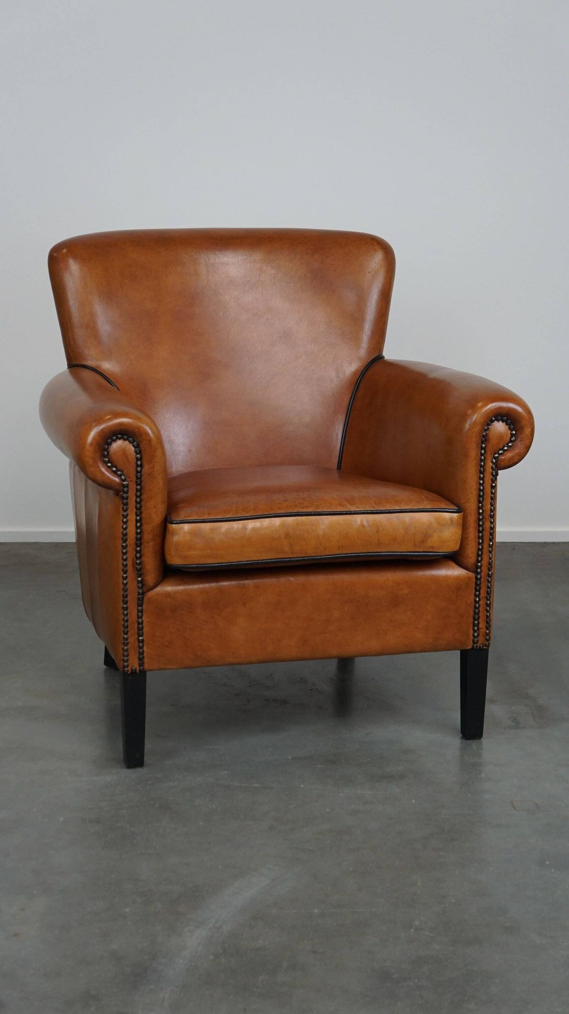 Fauteuil en cuir de mouton à l'aspect luxueux